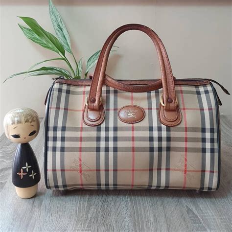 why are vintage burberry so cheap|Burberry bags old collection.